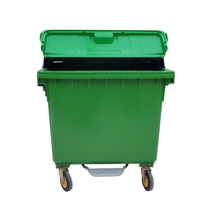 Green outdoor mobile garbage container with wheels and a hinged lid